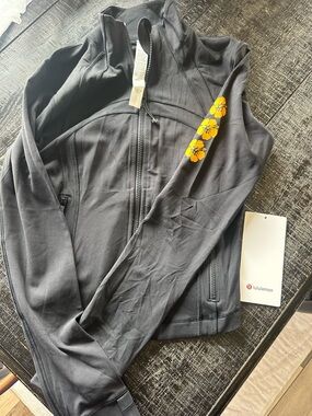 lululemon athletica Black Jacket with Yellow Floral Accent